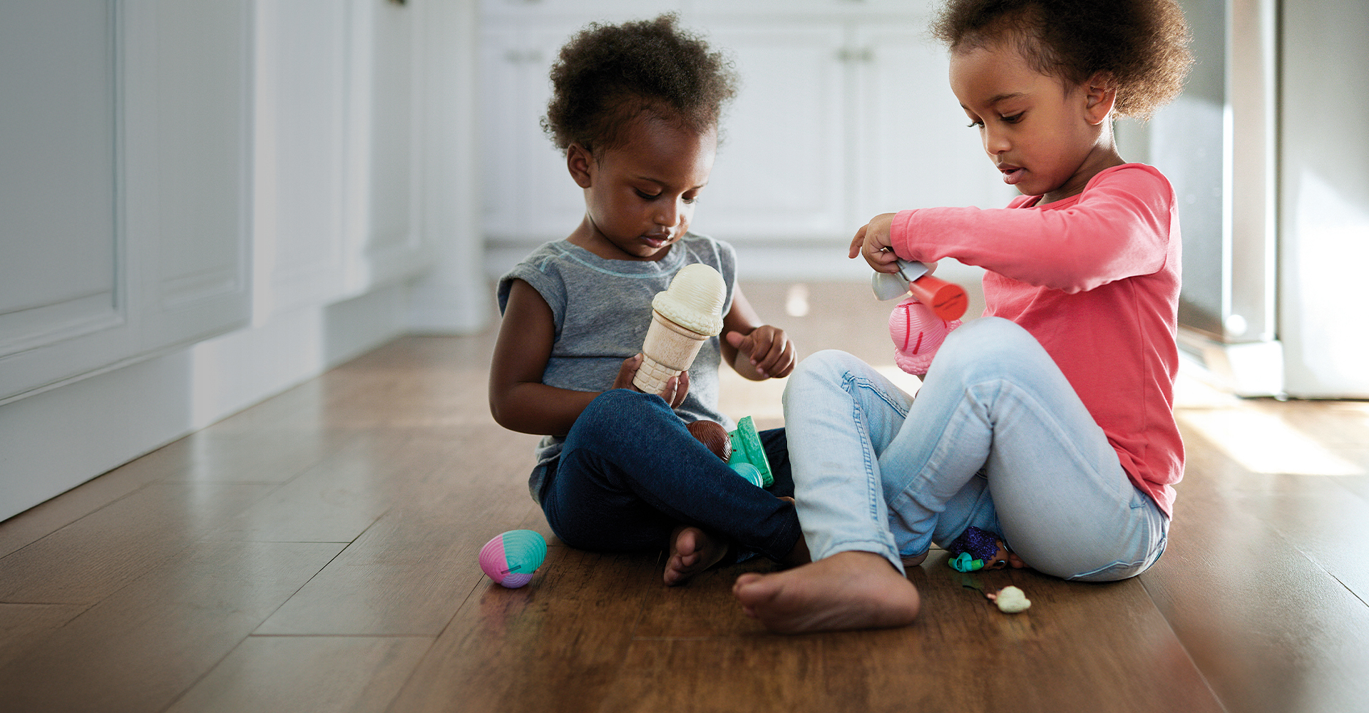 kids playing on hardwood floor